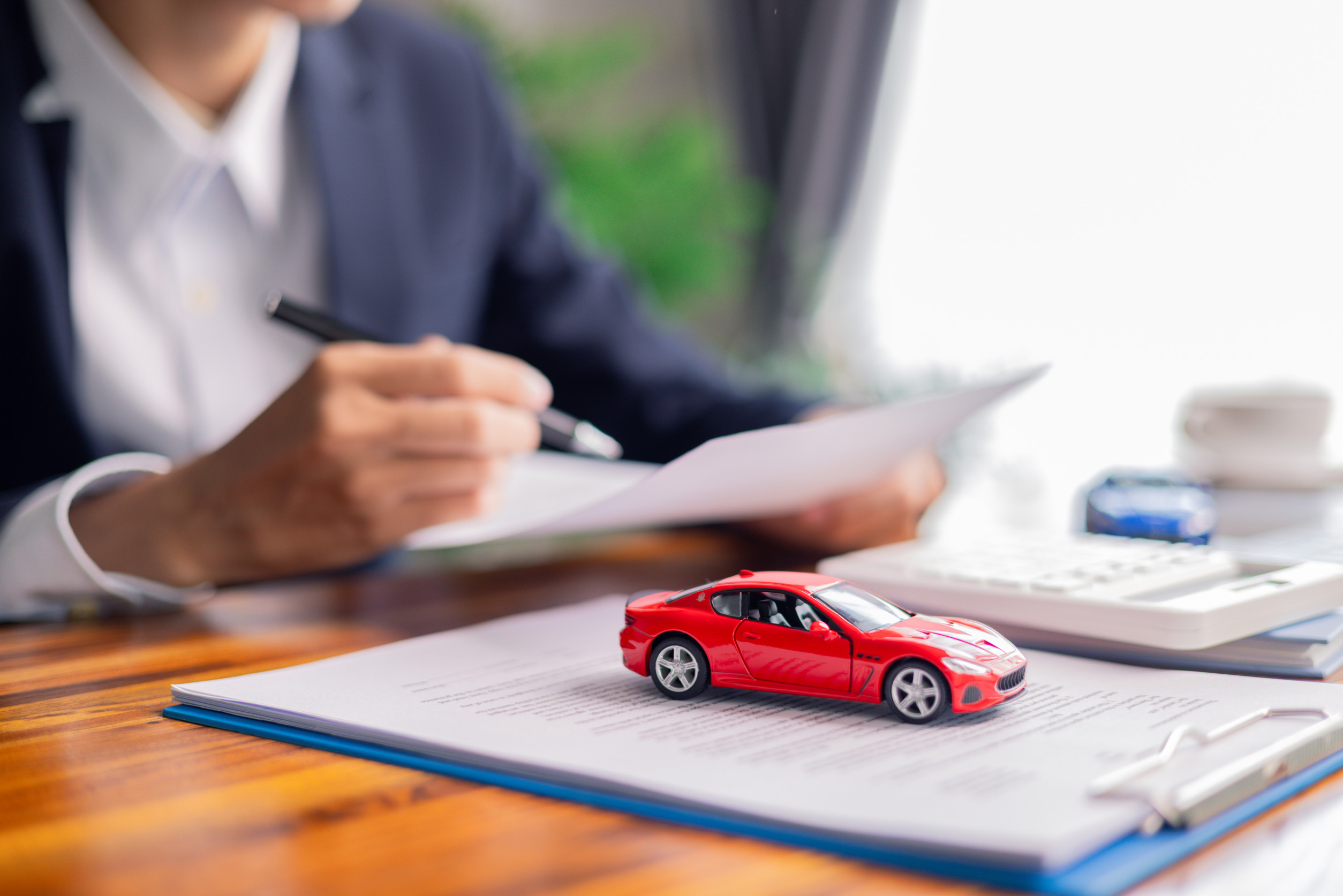 Client decided to buy new car, reviewing auto loan agreements, insurance contract, and other business documents needed for vehicle purchase. loan, business, car, agreements, contract, vehicle, client. Client decided to buy new car, reviewing auto loan agreements, insurance contract, and other business documents needed for vehicle purchase. loan, business, car, agreements, contract, vehicle, client